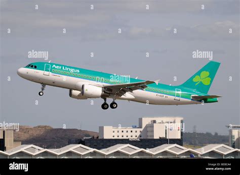 Side View Of Aer Lingus Airbus A320 Aeroplane Taking Off From