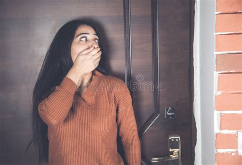 the frightened woman behind the door stock image image of room unhappy 182046129