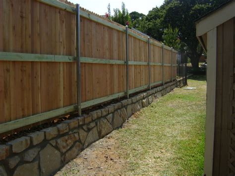 We offer several different types of wood fencing. Cedar Privacy Fence on Stone Retaining Wall - Dallas - by ...
