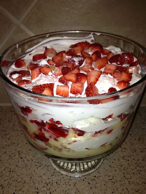 Make the vanilla pudding according to the package directions in a bowl, mix together the strawberries and white sugar. angel food cake trifle with jello