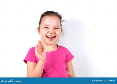 Laughing Six Years Old Little Beautiful Girl With Greeting Gesture