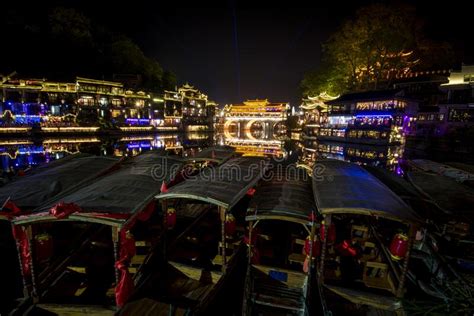 View Of Illuminated At Night Riverside Houses In Ancient Town Of