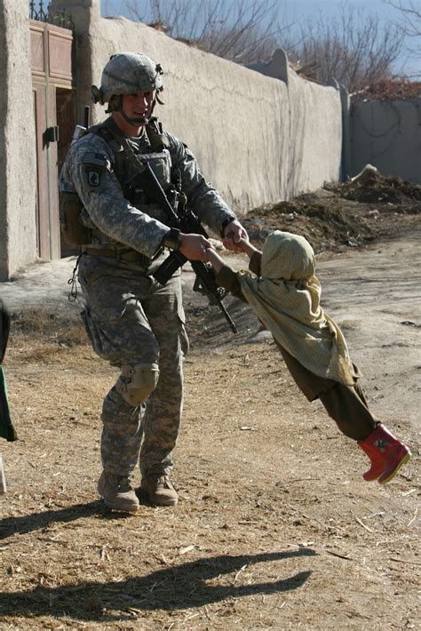 15 War Zone Photographs That Show Even Soldiers Have A Heart