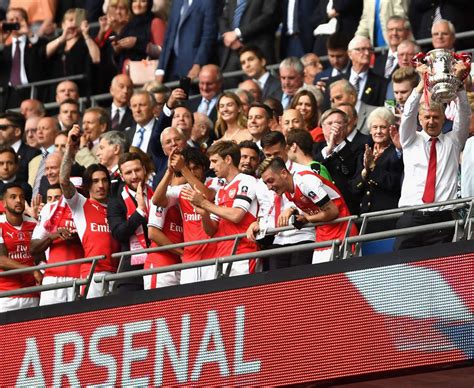 Arsenal lift the 2017 FA Cup trophy at Wembley - Daily Star