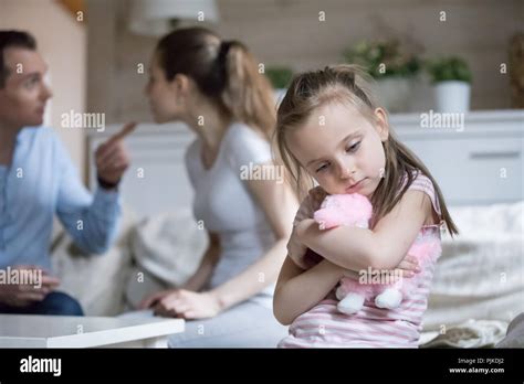 Lonely Little Girl Feel Sad Because Of Parents Fighting Stock Photo Alamy
