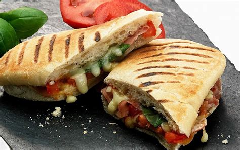 What's more perfect than hearty crusty bread, with a creamy and flavorful spread and veggies? Vegetarian panini | Food, Italian recipes, Food recipes