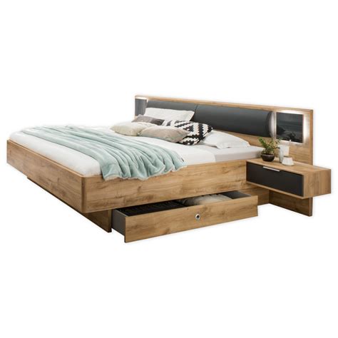 It stands mostly above the bed frame. Futonbett VALENCIA - Plankeneiche - Graphit - 180x200 cm | Online bei ROLLER günstig kaufen!