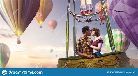 Young Beautiful Multiethnic Couple Kissing In The Hot Air Balloon
