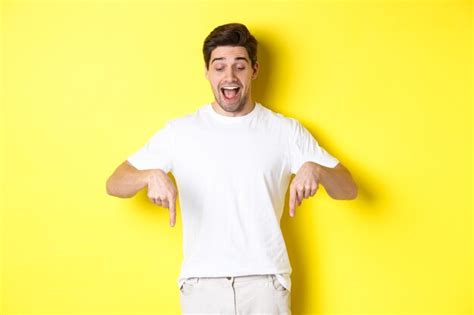 Free Photo Image Of Amused Handsome Guy In White T Shirt Looking And