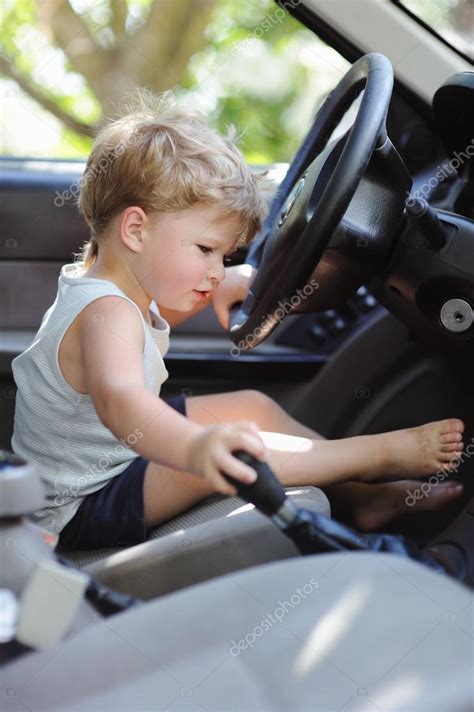 Cute Little Boy Driving Fathers Car — Stock Photo © Moravska 68150519