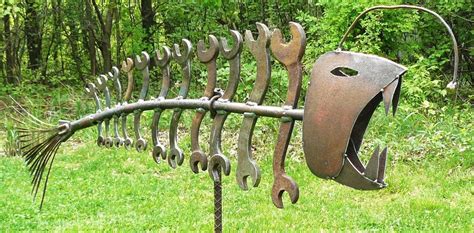 Yard art & garden decor ideas in love with this creative metal yard art from ' zest it up '. Gone COASTAL Found object metal fish garden by ...