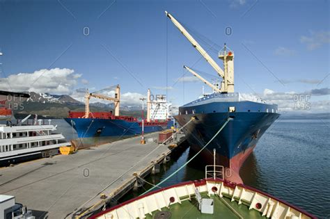 Large ships docked in a harbor stock photo - OFFSET
