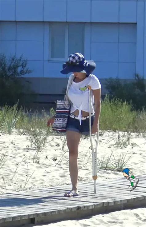 Woman Amputee On Crutches