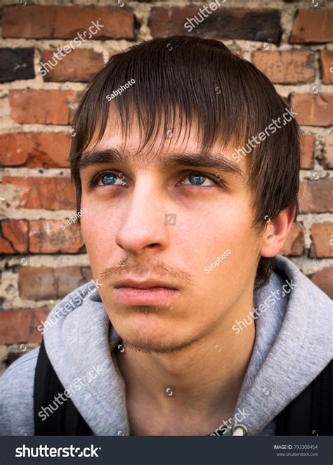 Sad Young Man On Wall Background Stock Photo 793308454 Shutterstock