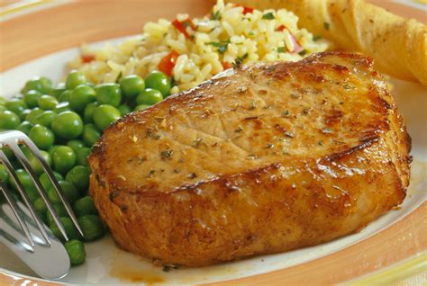 Looking for easy pork chop recipes? Recipes | Easy Cheesy Pork Chop and Rice Casserole | Fareway
