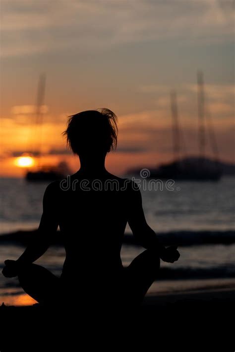 Silhouette Of A Fitness Woman Exercising Yoga Meditation Exercises