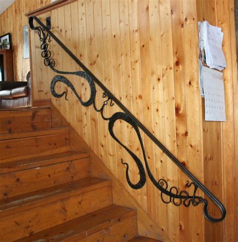 We haven't finished the upstairs banisters yet but the main floor ones are finished. Wall mounted hand rail MADE TO ORDER by ...