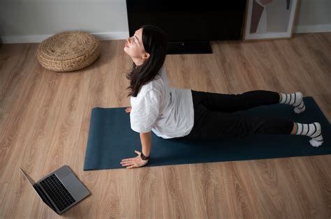 Free Photo Woman Doing Yoga At Home During Quarantine