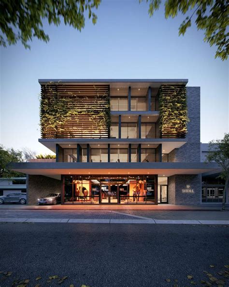 An Architecturally Designed Building With Plants Growing On Its Side