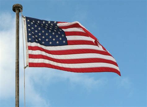 Free Stock Photos A Us Flag Flying In A Blue Sky 3946
