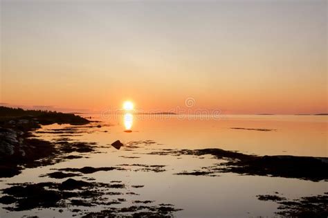 Beautiful Early Morning Sunrise Landscape Of White Sea Water Dramatic