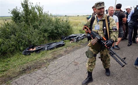 Dozens of bodies were scattered around the smoldering wreckage. Photos: Ukraine rebels move MH17 victim's bodies, tamper ...