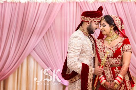 couple s wedding portraits red lengha bride and groom jsk photography marriage poses