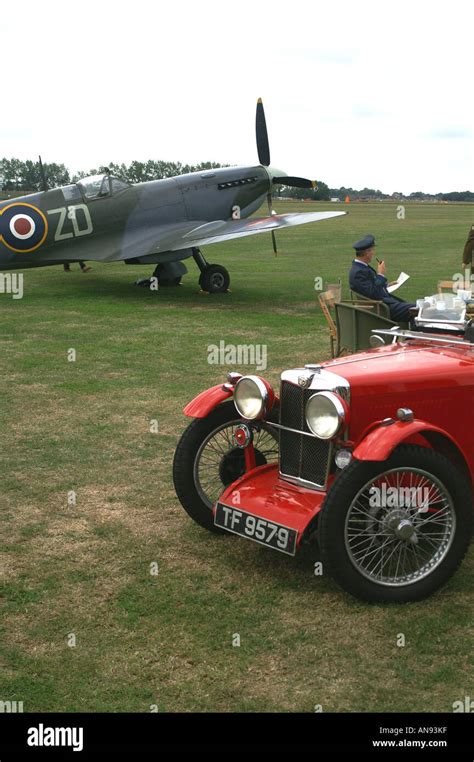 Battle Of Britain Spitfire Raf Pilot And Mg Sports Car Stock Photo
