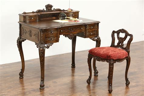 Writing desk features two storage drawers and carved detail legs. SOLD - French Style Antique Carved Writing Desk & Chair ...