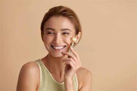 Face Massage Laughing Woman Posing With Jade Facial Roller For Skin Care Stock Image Image Of