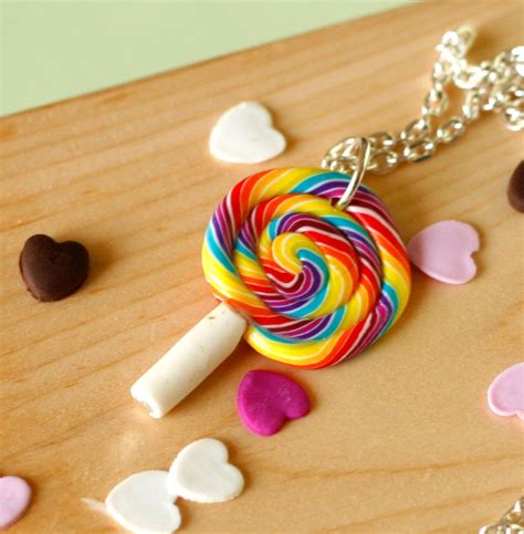 A Lollipop Is Sitting On A Wooden Table Surrounded By Hearts And Other