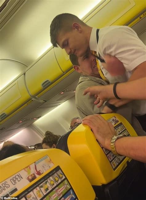 Exclusive Terrifying Moment Drunk Ryanair Passenger Struggles With Cabin Crew After Buying A