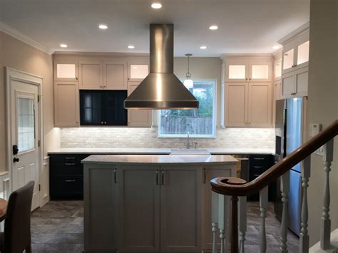 Check out our review page and our past customers will verify we work really hard at being the best kitchen cabinet refacing company in our area. White cabinets with dark blue accents, interior lighting, undercabinet lighting, - Transitional ...