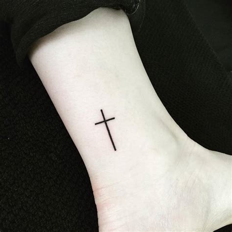 Religious temporary tattoos for women and men. Small Christian cross tattoo on the ankle.