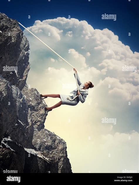 Businesswoman Climbing Mountain Stock Photo Alamy