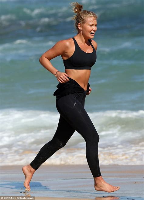 Lara Bingle Shows Off Her Toned And Tanned Abs As She Keeps Fit By Jogging On The Beach Daily