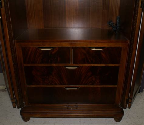 White gloss is always a good furniture finish. American Drew wardrobe / entertainment center