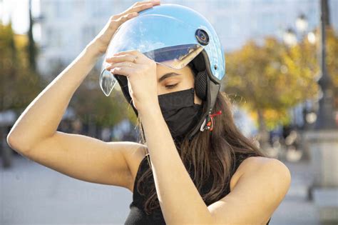 Close Up Of Young Woman Wearing Helmet Stock Photo