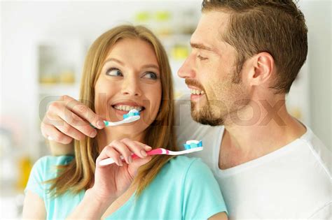 Young Couple Brushing Their Teeth Stock Image Colourbox