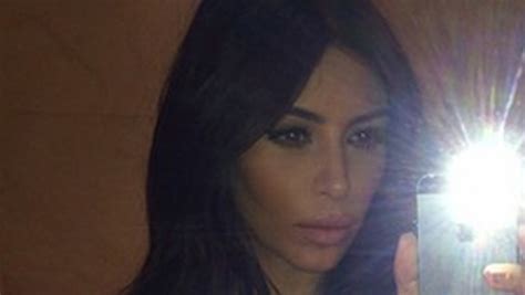 Kim Kardashian Flaunts Major Cleavage In Sexy Célfie