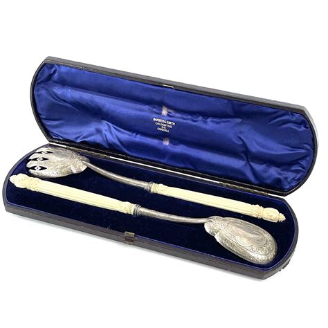 Lot 31 A Cased Pair Of Victorian Silver Serving
