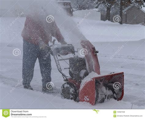 Snow Blowing A Driveway On A Blustery Winter Day Stock Photo Image Of