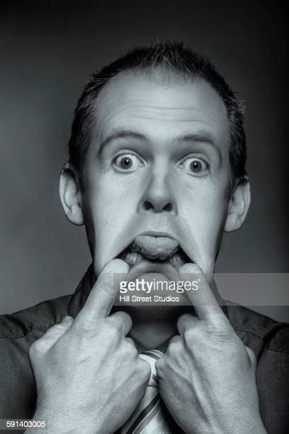 Man Pulling Funny Faces Close Up Photos And Premium High Res Pictures