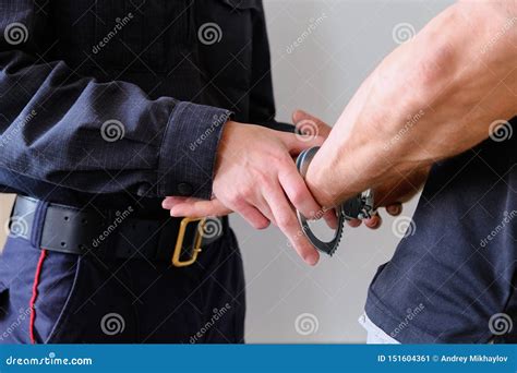 Buttons Cop Handcuffs An Arrested Criminal The Man At The Police