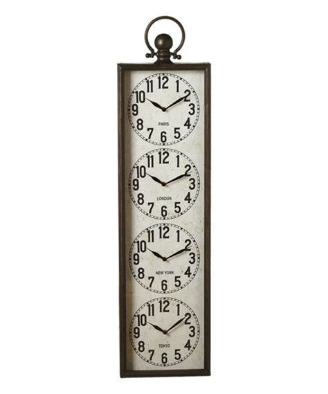 Three Clocks Hanging From The Side Of A Metal Wall Mounted Clock On A White Background