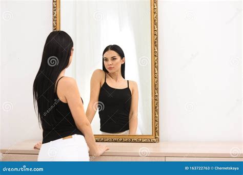 Beautiful Young Woman Looking At Herself In Mirror Stock Image Image