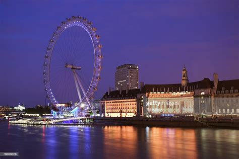 Ferris Wheel Along The Thames River In London England High Res Stock