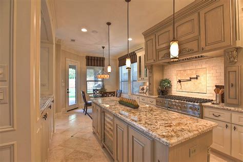 Delicatus white granite kitchen countertops contrasted with a blue eyes granite island. 29+ Popular Cream Granite Countertop Ideas ( Projects & Tips )
