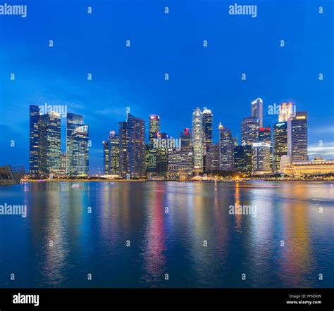 Singapore Skyline Across Marina Bay Singapore Southeast Asia At Night