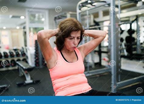 Beautiful Fit Senior Woman Working Her Abs Doing Crunches Stock Image